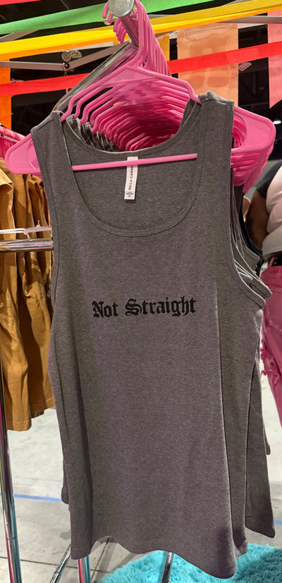 Gray tank top with 'Not Straight' text on a rack with colorful hangers in the background.