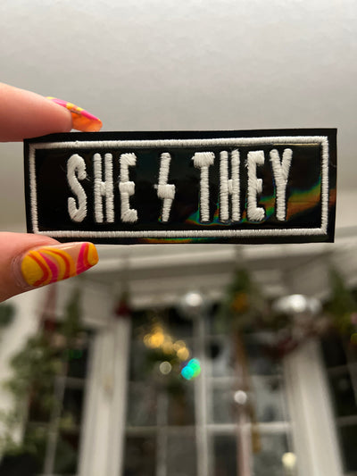 She/They Pronoun black holographic Patch with glow in the dark thread